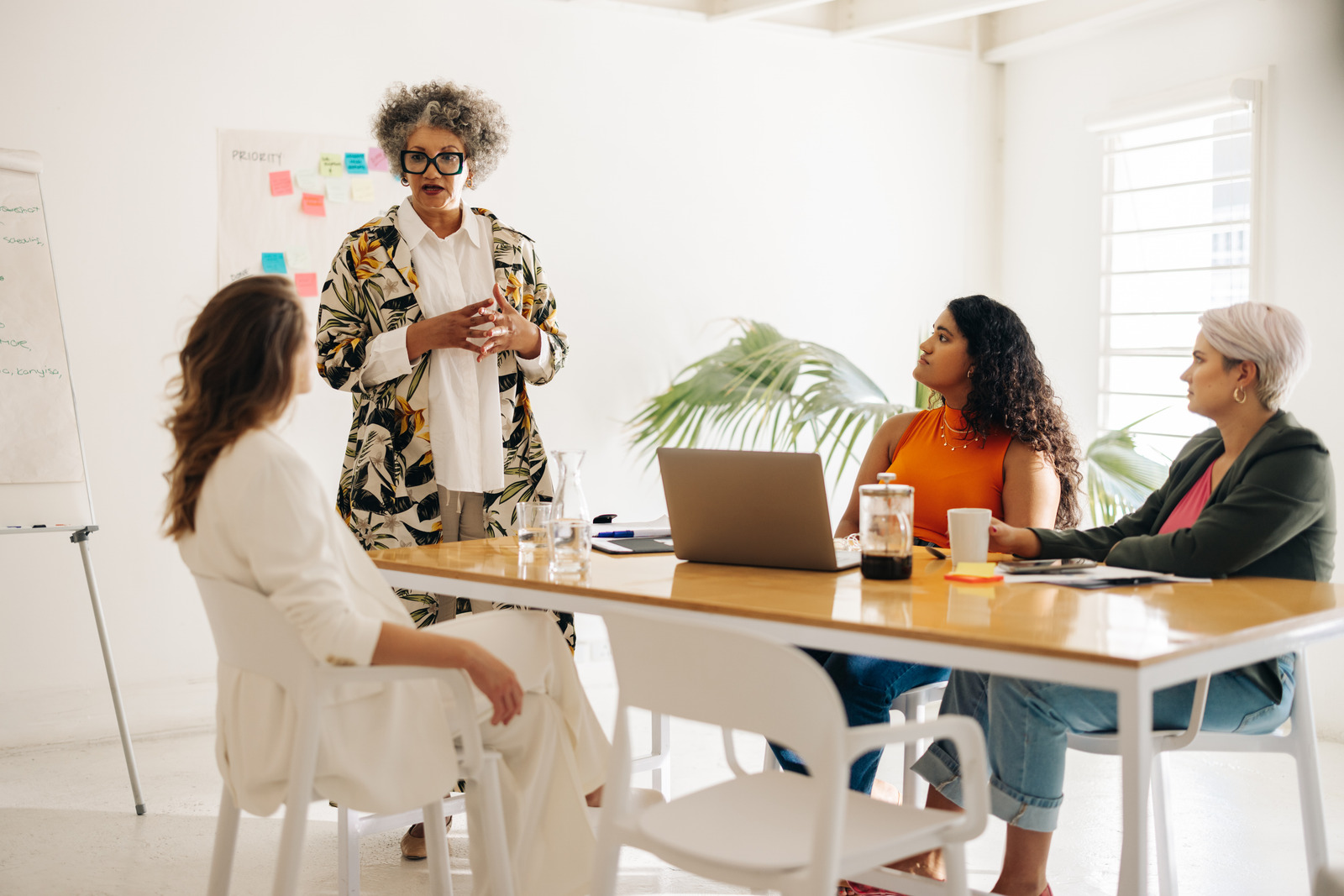 A manager leading a discussion with her team